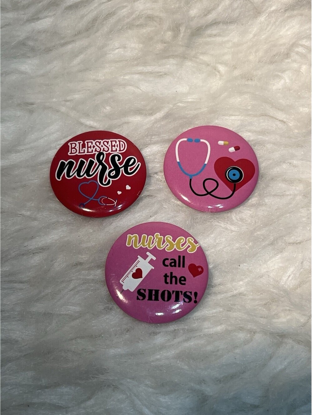 set of three nurse-themed pinback buttons